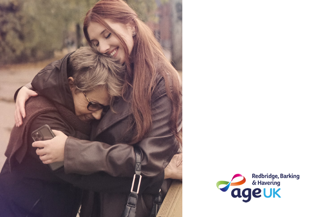 An elderly lady being embraced by her daughter 