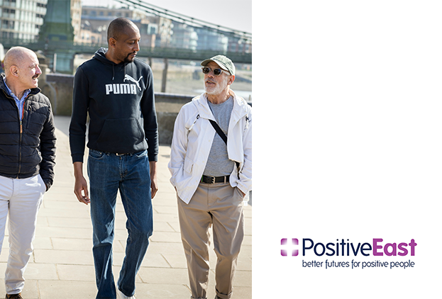 Three men walking along the Southbank of London