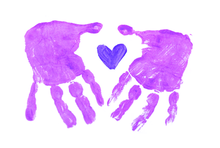 Artwork: a hand print with a love heart print in the centre