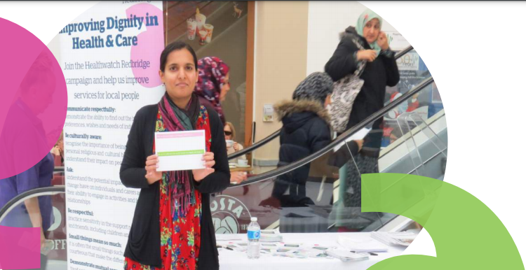 A Healthwatch volunteer doing outreach at Queen's Hospital, holding a leaflet