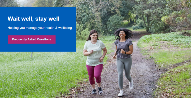 Two women jogging on path