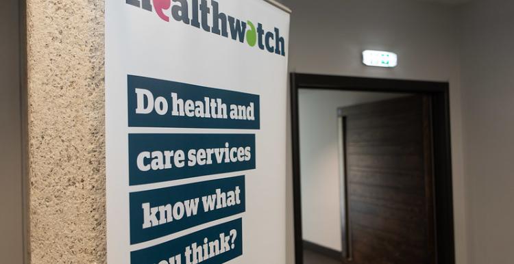 A photo of a Healthwatch banner that reads 'Do health and care services know what you really think?'