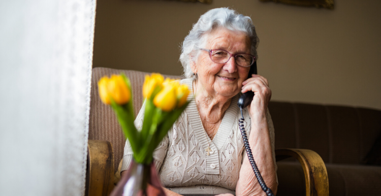 An elderly lady on the phone
