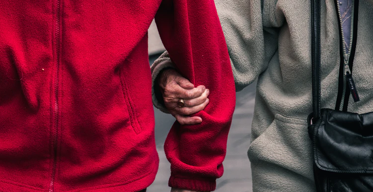 A carer supporting a client walking side by side