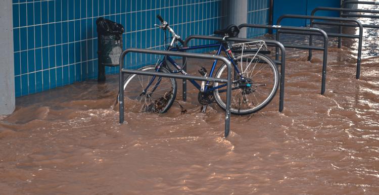 A chained up bike in flood water
