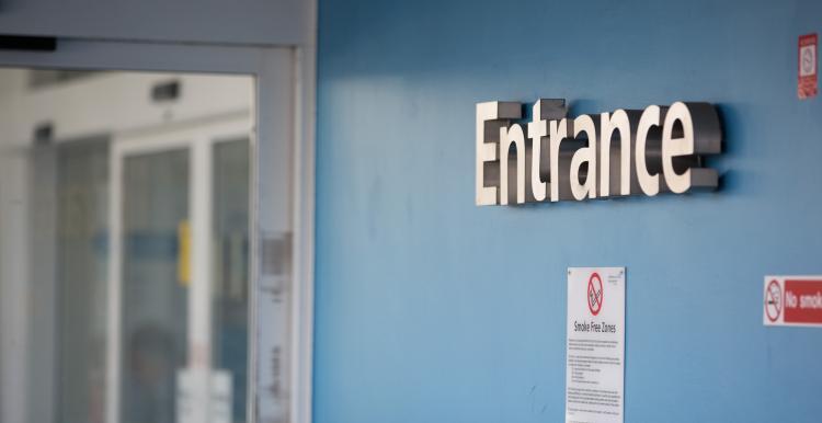 Entrance sign in hospital corridor