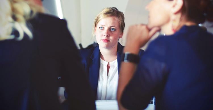 A lady sat at a job interview