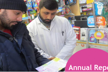 two male Redbridge residents looking at a Healthwatch leaflet