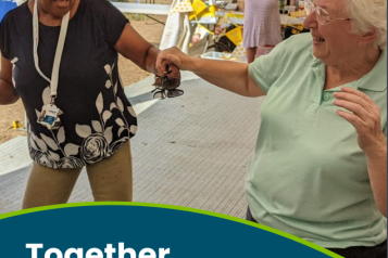 Two volunteers dancing together