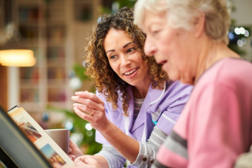 A Dementia Befrender having a cup of tea and a chat with a lady with dementia