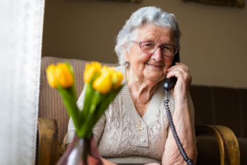 An elderly lady on the phone