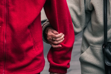 A carer supporting a client walking side by side