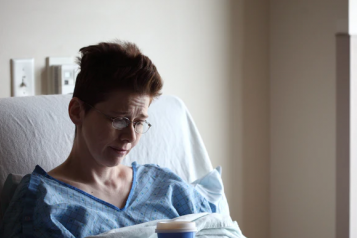 Female patient in hospital bed