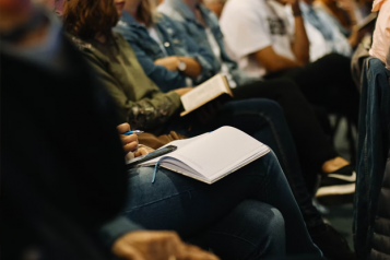 A group of people sat at a meeting