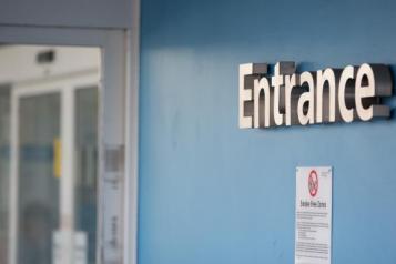 Entrance sign in hospital corridor