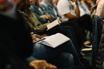 A group of people in a meeting