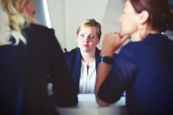 A lady sat at a job interview