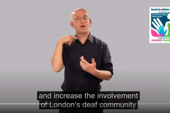 Screenshot from a video of a man doing sign language