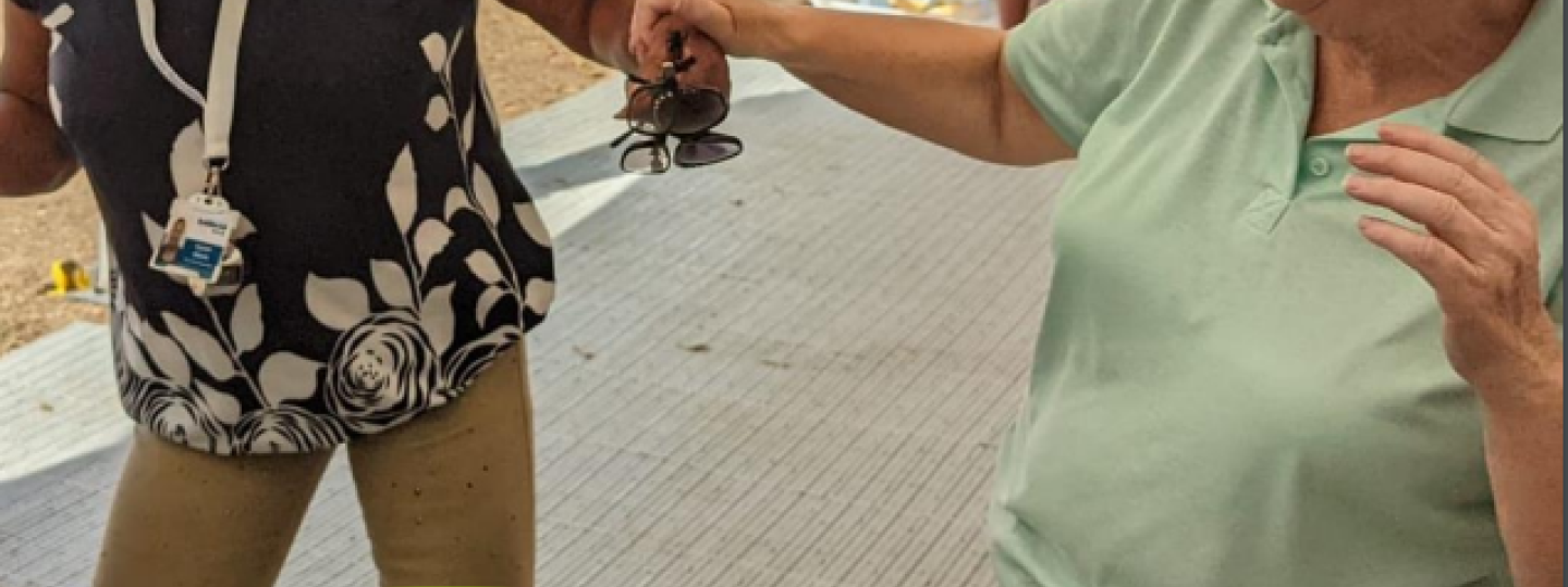 Two volunteers dancing together