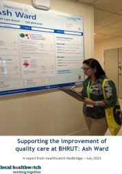 volunteer looking at hospital noticeboard