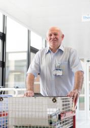 Hospital porter with a trolley