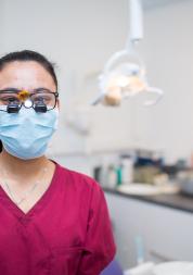 Dentist wearing goggles and mask