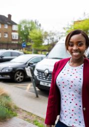 Woman stood in front of an ambulance