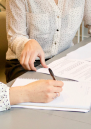 Close up to 2 women looking at a financial statement